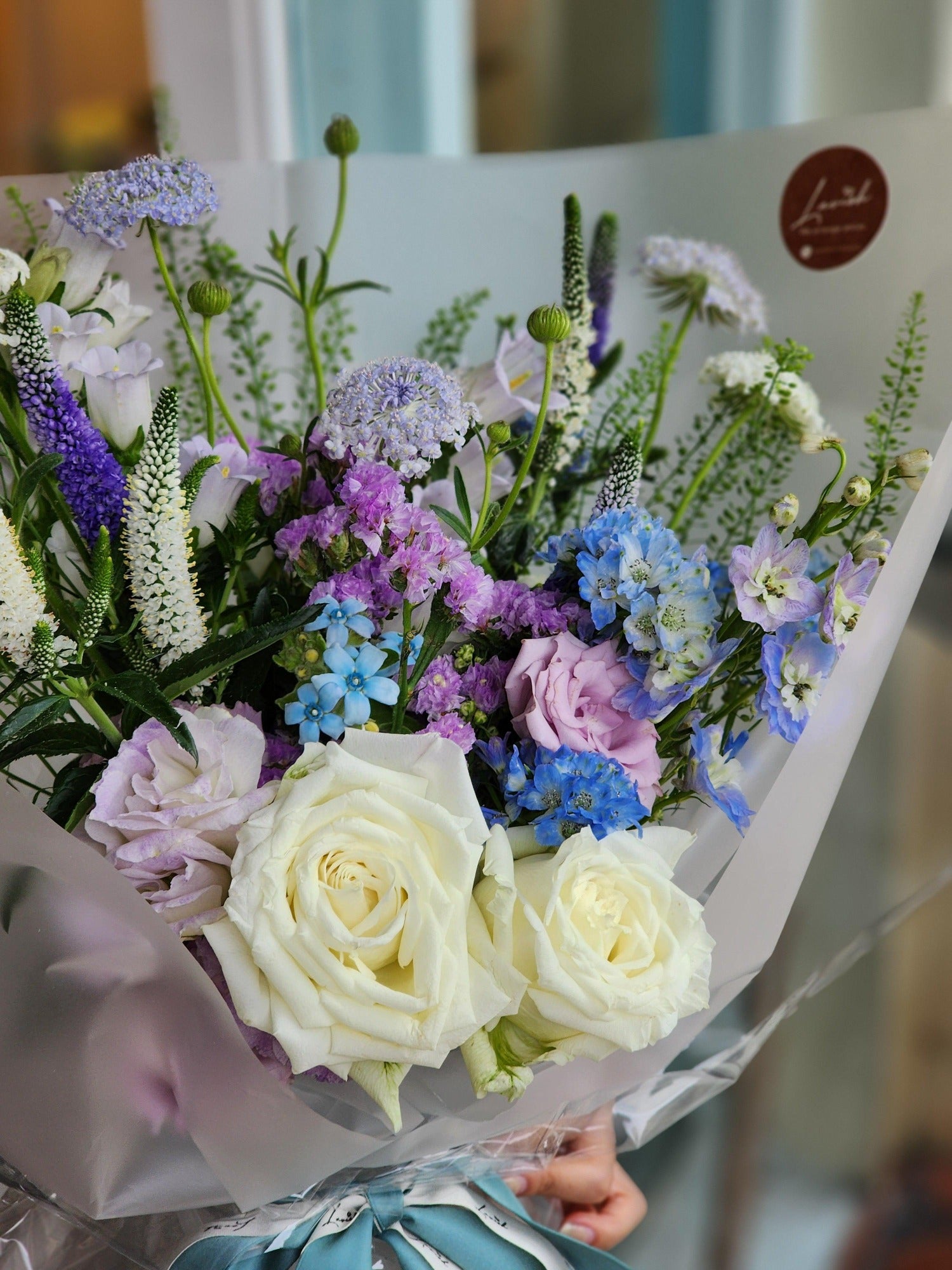 Soft white roses and stunning blue tweed bouque - Lavish Florist